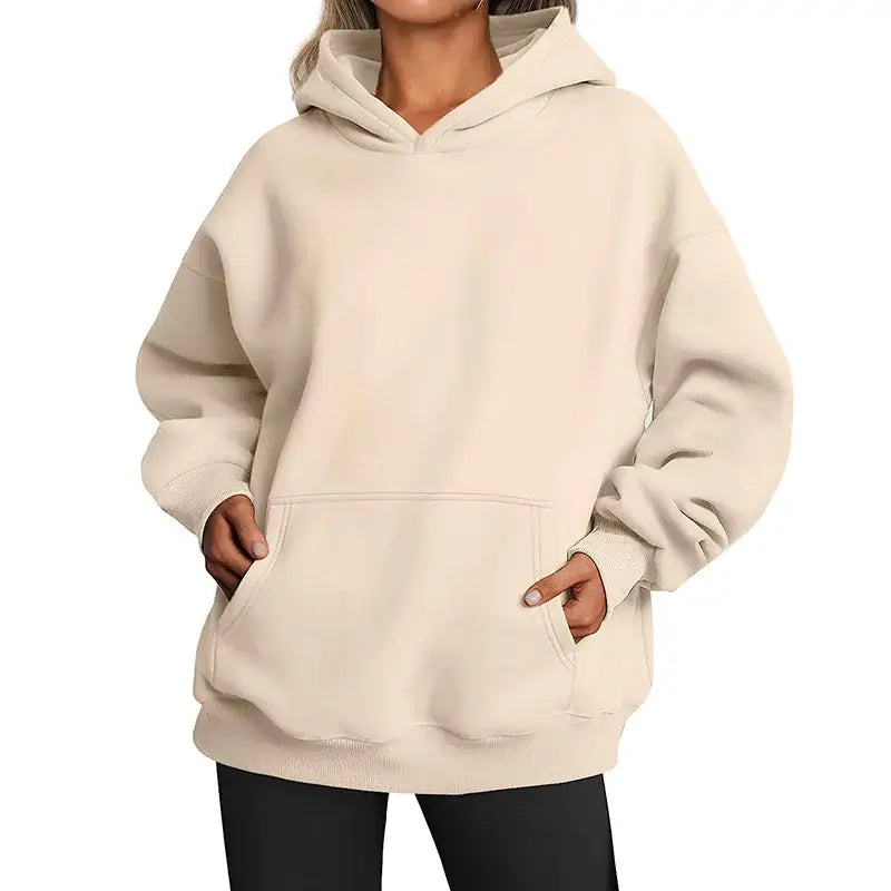 womens hoodies with pockets big in a light beige color, featuring a cozy oversized fit and a front pocket.