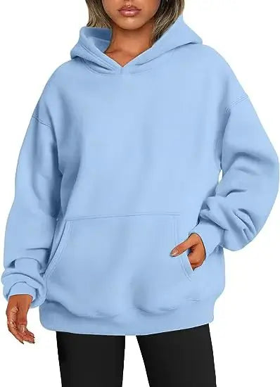 Womens Hoodies With Pockets big in light blue color, featuring a cozy oversized fit and practical front pockets.